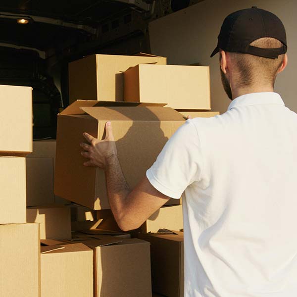 Picture of man unloading boxes